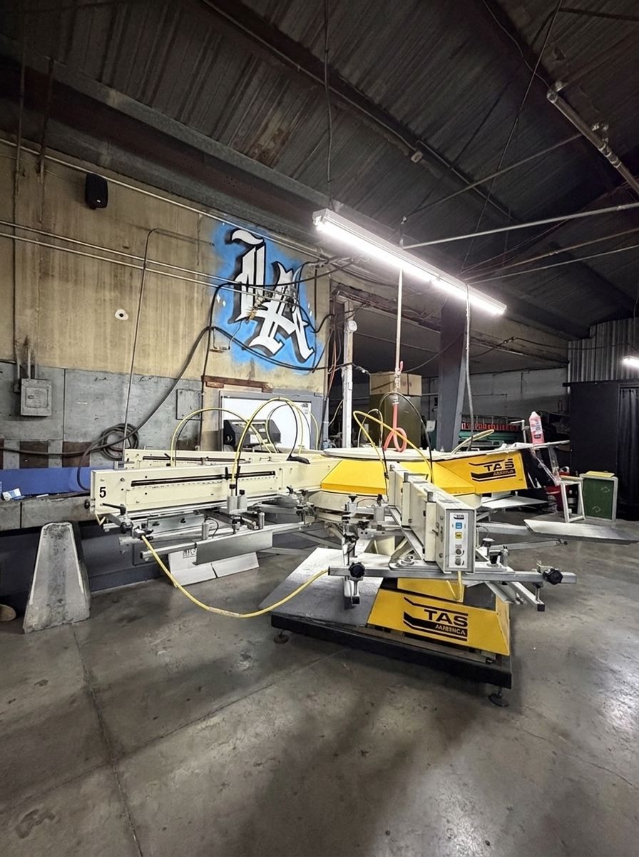 Automatic screen printing press at Last Stop Lab